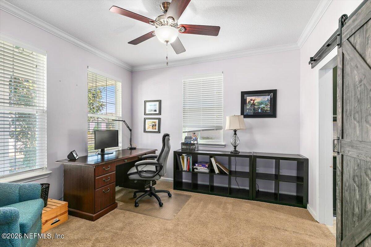 53 Monroe Avenue St. Augustine, FL 32086 - Photo 4 of 26 a view of a livingroom with workspace and a window