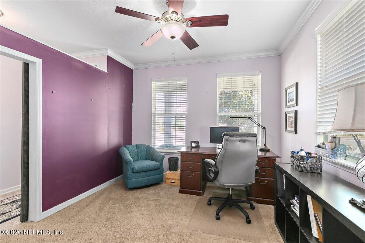 53 Monroe Avenue St. Augustine, FL 32086 - Photo 5 of 26 a livingroom with workspace and a window