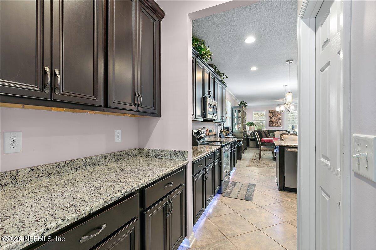 53 Monroe Avenue St. Augustine, FL 32086 - Photo 8 of 26 a kitchen with lots of counter top space and appliances