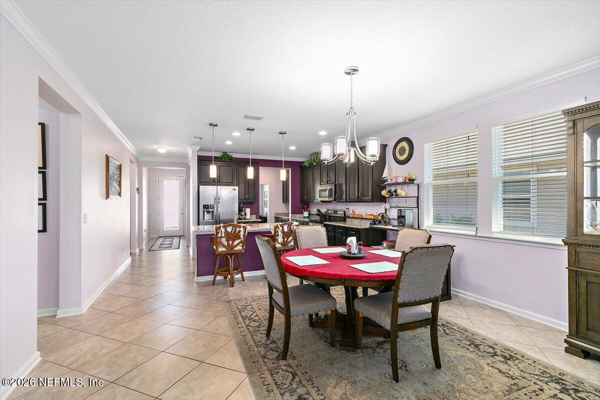 53 Monroe Avenue St. Augustine, FL 32086 - Photo 9 of 26 a dining room with furniture and window