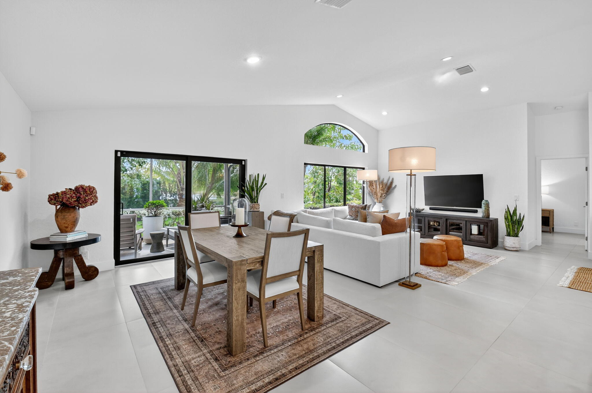 1175 Sea Grape Circle Delray Beach, FL 33445 - Photo 18 of 64 a living room with furniture and a flat screen tv