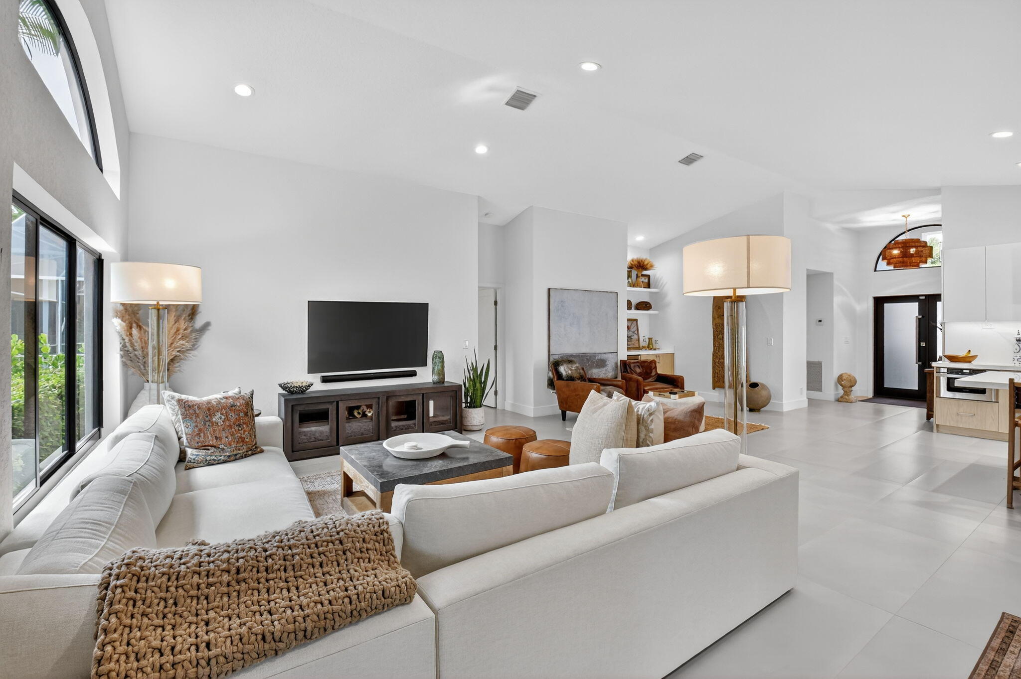 1175 Sea Grape Circle Delray Beach, FL 33445 - Photo 20 of 64 a living room with furniture and a flat screen tv