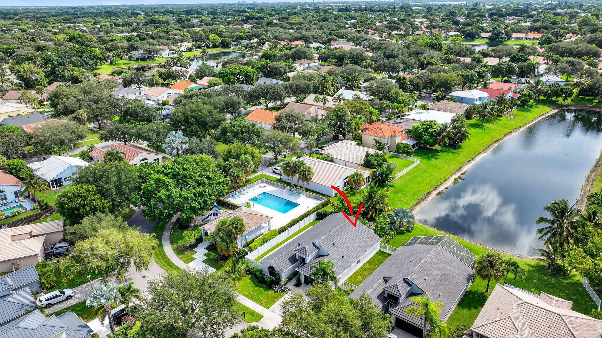 1175 Sea Grape Circle Delray Beach, FL 33445 - Photo 2 of 64 an aerial view of residential houses with outdoor space and trees