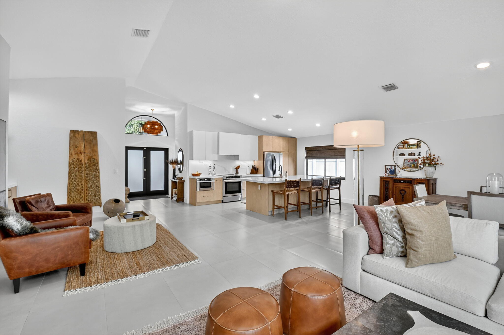 1175 Sea Grape Circle Delray Beach, FL 33445 - Photo 24 of 64 a living room with furniture and kitchen view