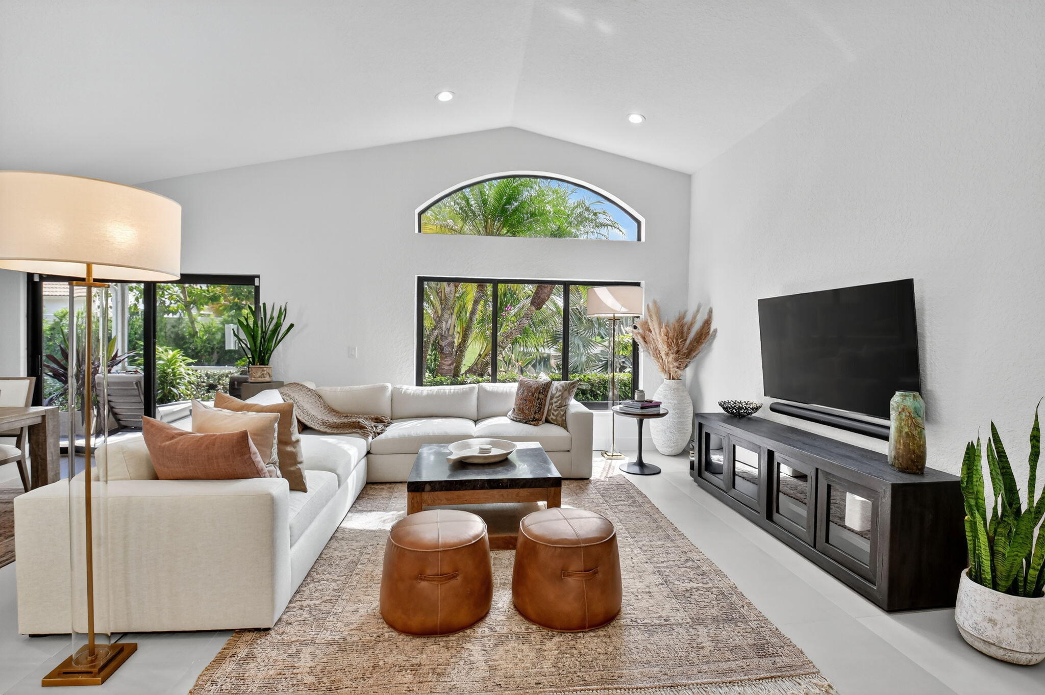 1175 Sea Grape Circle Delray Beach, FL 33445 - Photo 26 of 64 a living room with furniture and a flat screen tv