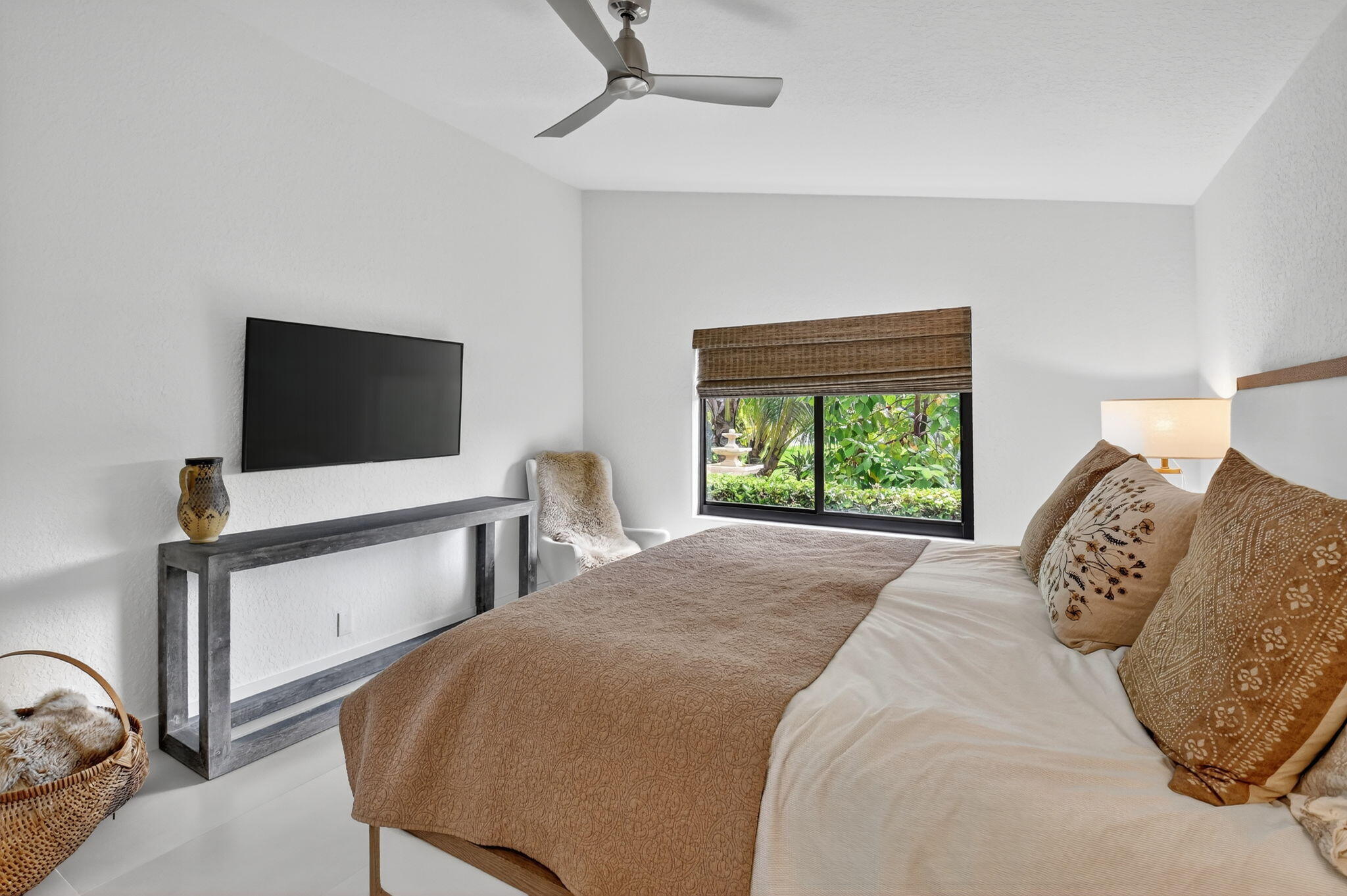 1175 Sea Grape Circle Delray Beach, FL 33445 - Photo 29 of 64 a bedroom with a bed tv and a window