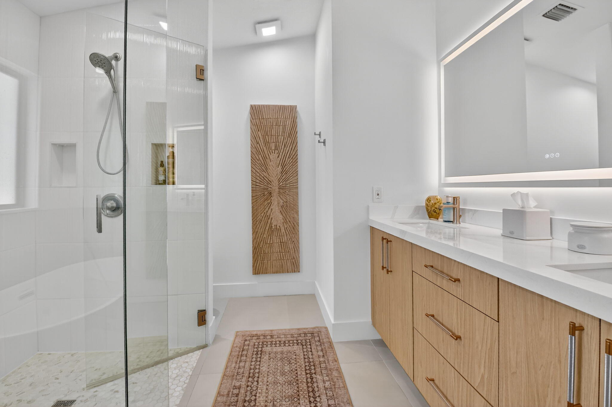 1175 Sea Grape Circle Delray Beach, FL 33445 - Photo 31 of 64 a bathroom with a shower sink and mirror