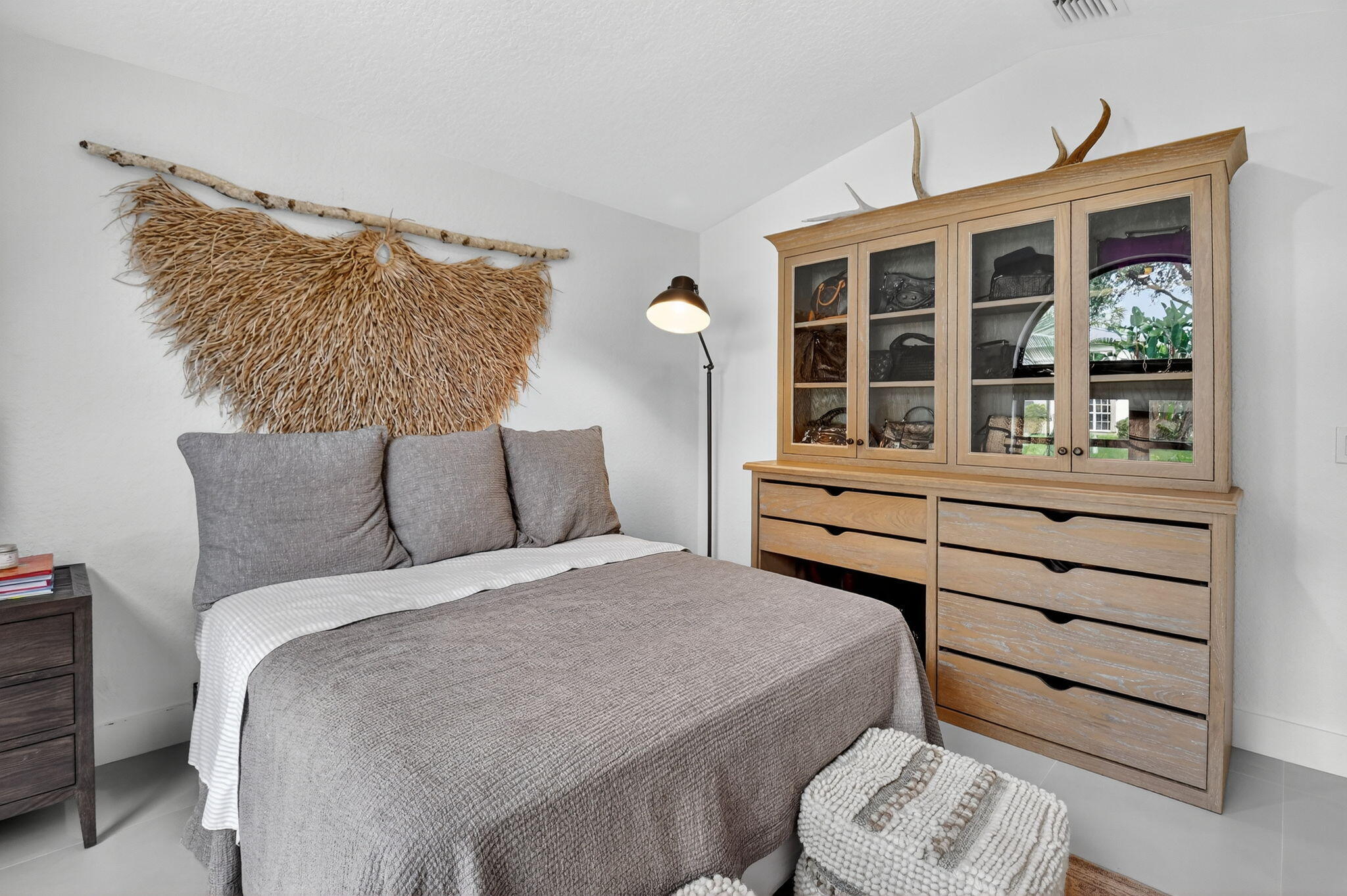 1175 Sea Grape Circle Delray Beach, FL 33445 - Photo 38 of 64 a bedroom with a bed and a window