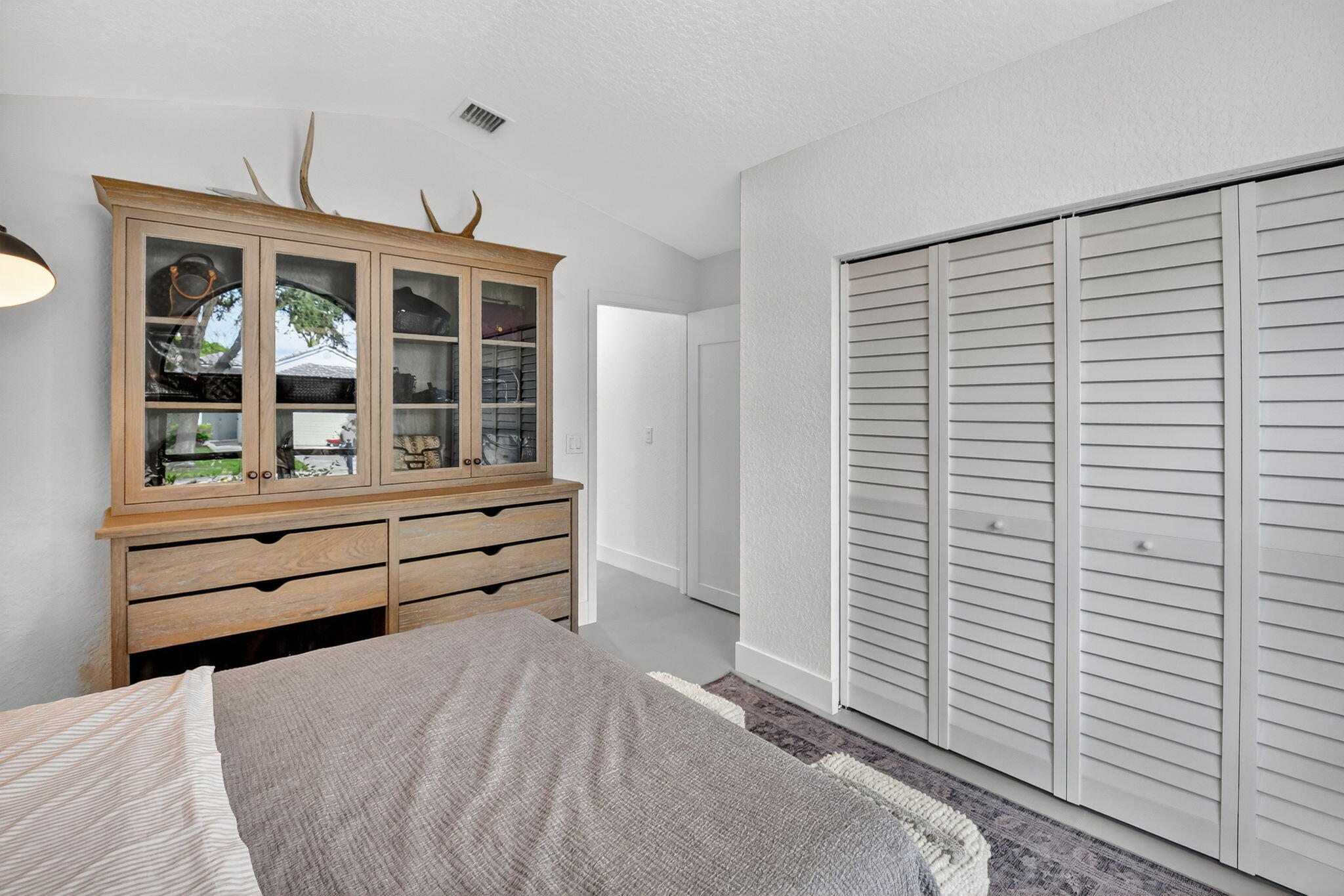 1175 Sea Grape Circle Delray Beach, FL 33445 - Photo 39 of 64 a bed room with a bed and a window