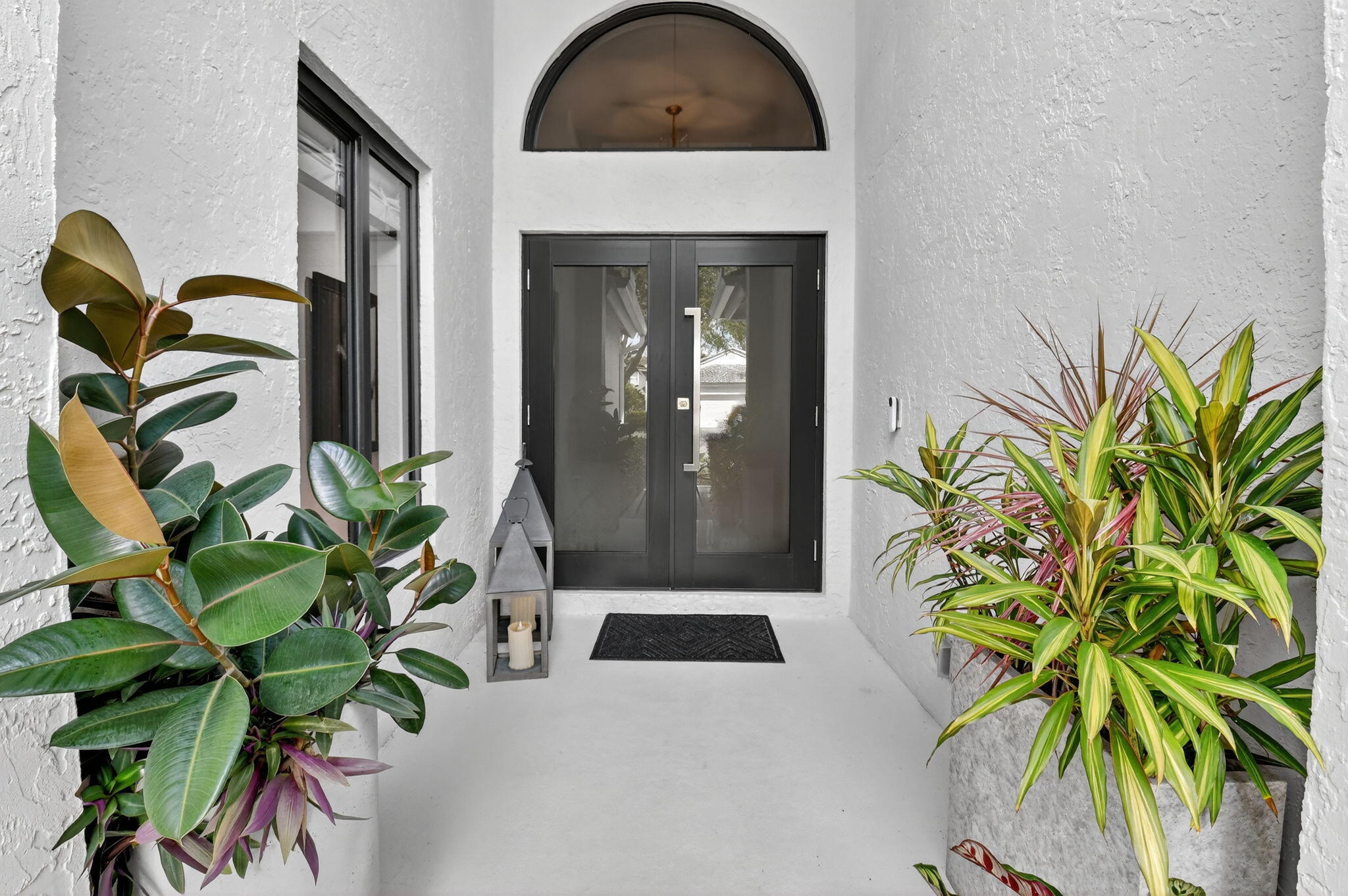 1175 Sea Grape Circle Delray Beach, FL 33445 - Photo 4 of 64 a view of entryway with flower around