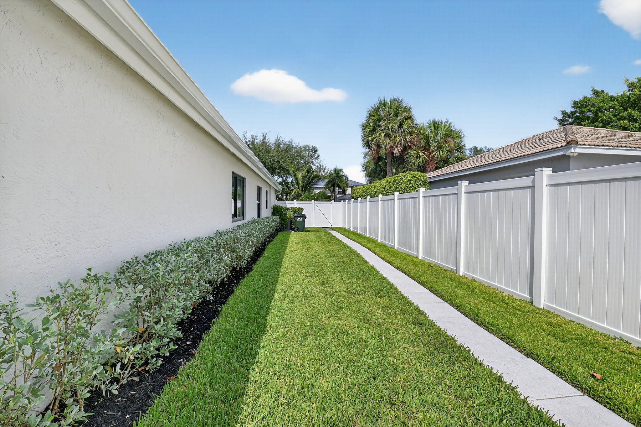 1175 Sea Grape Circle Delray Beach, FL 33445 - Photo 45 of 64 a view of a backyard with pathway