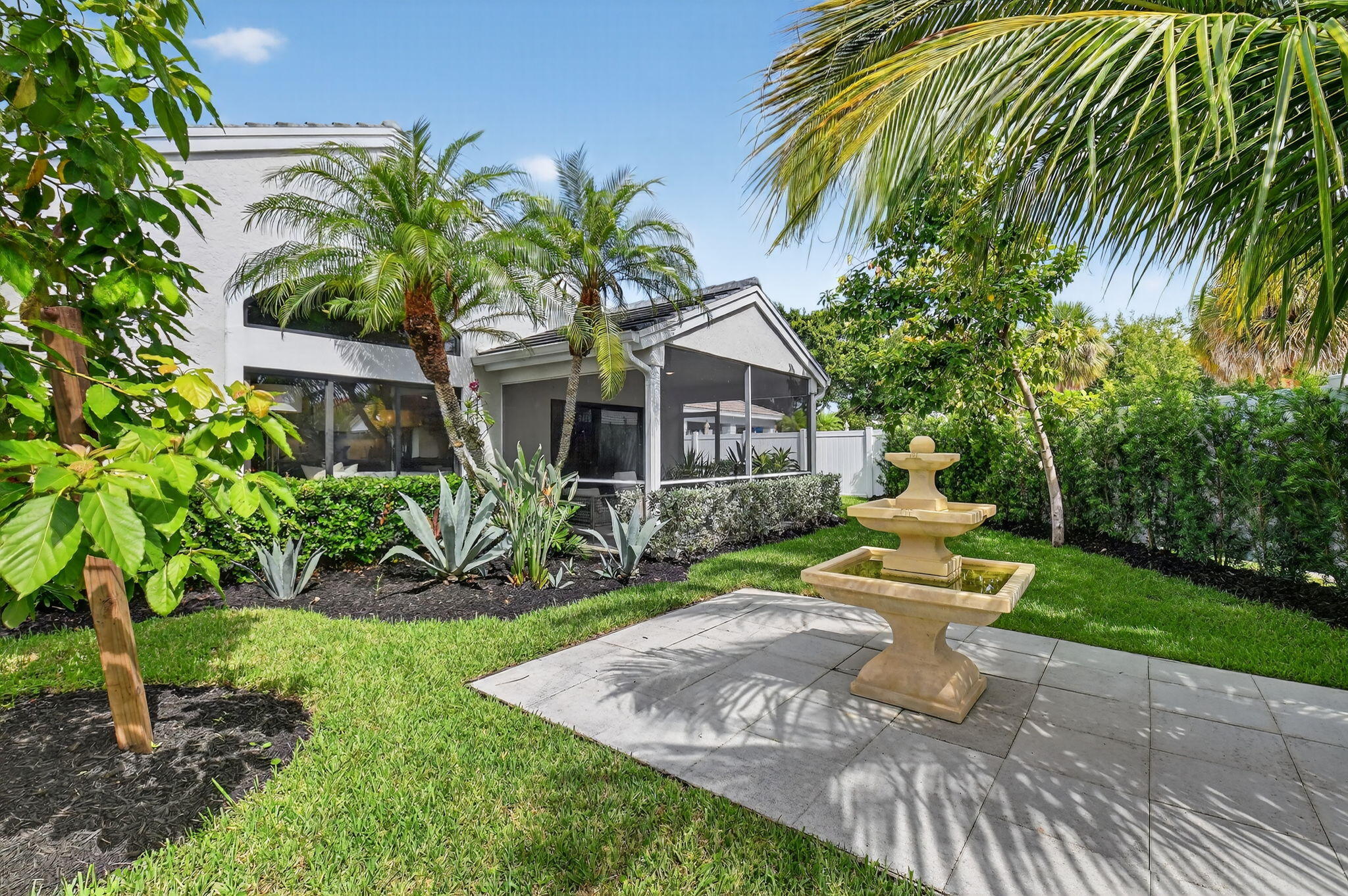1175 Sea Grape Circle Delray Beach, FL 33445 - Photo 49 of 64 a front view of a house with garden