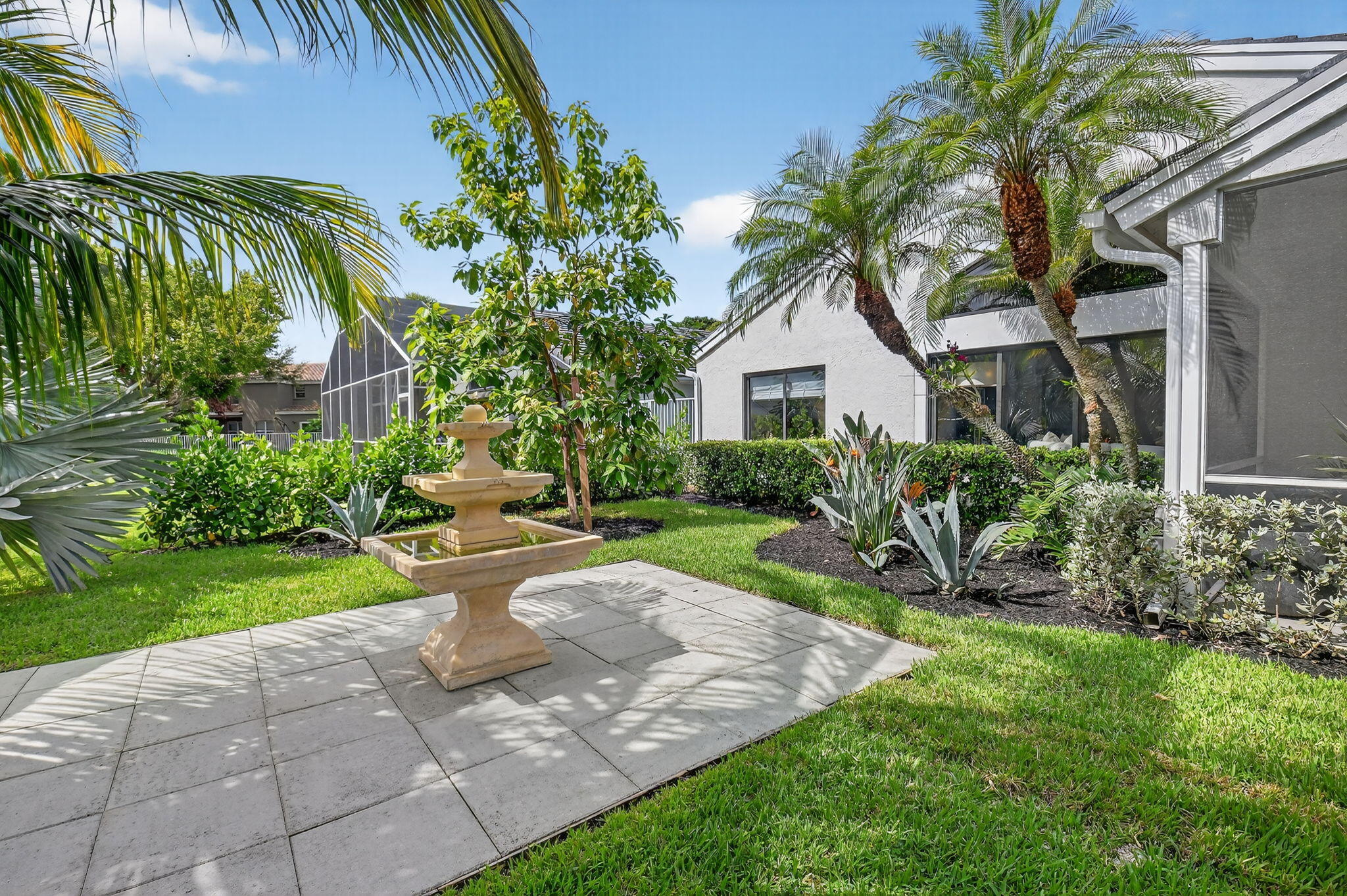 1175 Sea Grape Circle Delray Beach, FL 33445 - Photo 52 of 64 a front view of a house with a garden