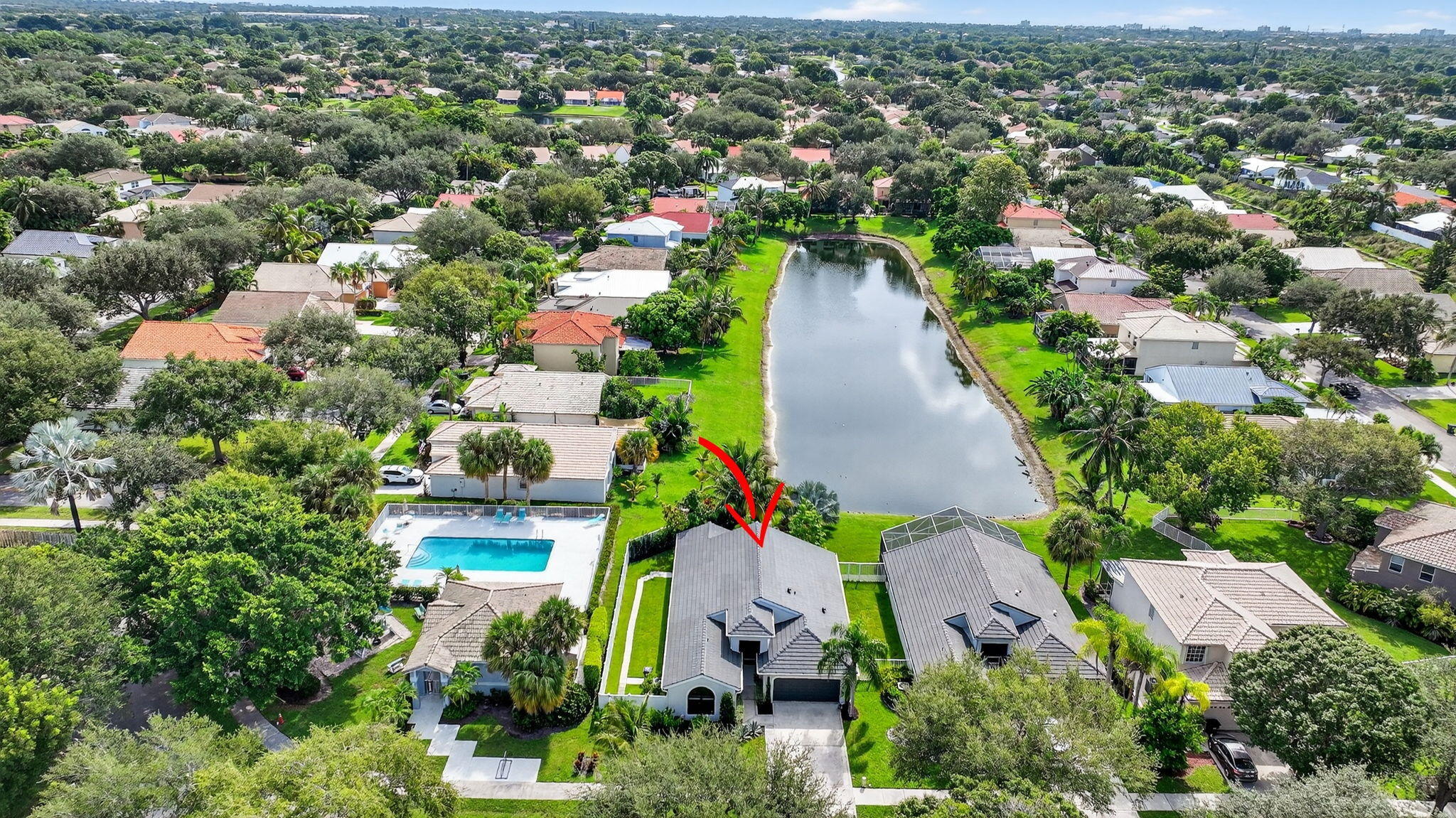 1175 Sea Grape Circle Delray Beach, FL 33445 - Photo 57 of 64 an aerial view of residential houses with outdoor space and trees