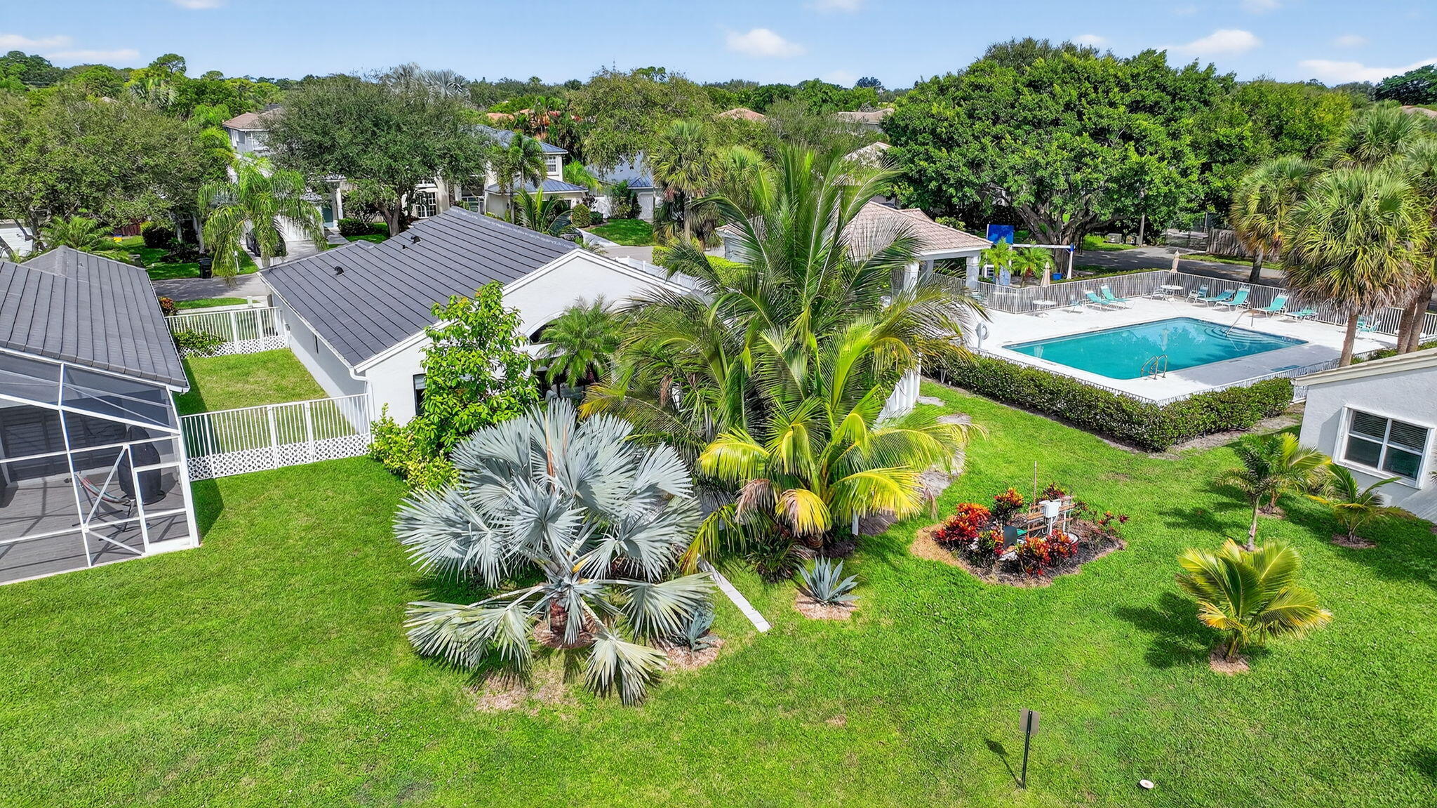 1175 Sea Grape Circle Delray Beach, FL 33445 - Photo 62 of 64 a view of a house with a backyard and a garden