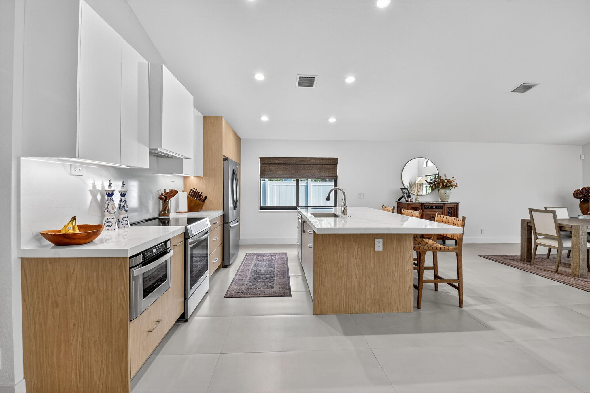 1175 Sea Grape Circle Delray Beach, FL 33445 - Photo 8 of 64 a kitchen with granite countertop a sink and cabinets