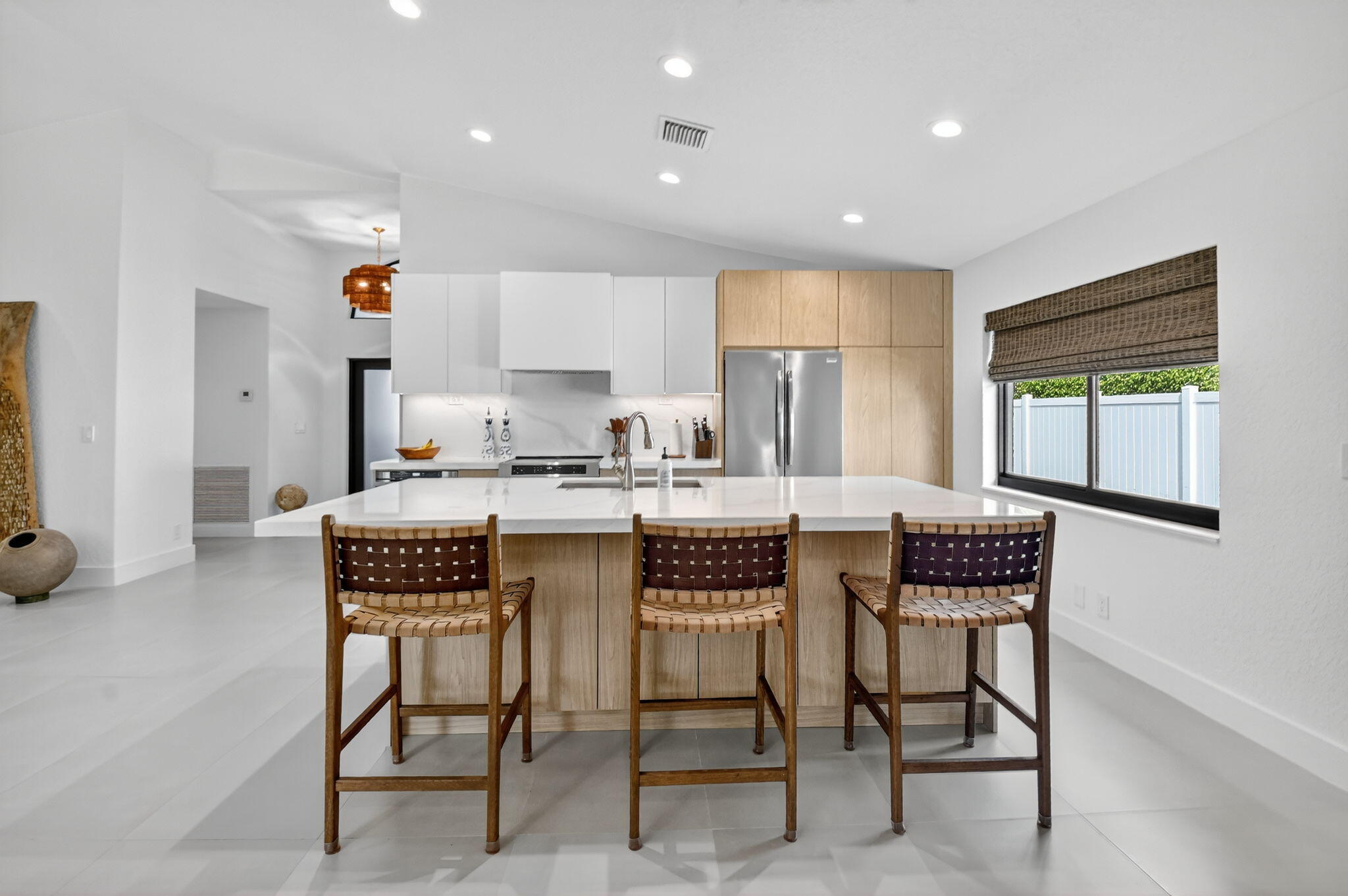 1175 Sea Grape Circle Delray Beach, FL 33445 - Photo 10 of 64 a kitchen with a dining table chairs and window