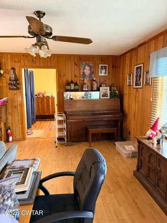 a bedroom with a bed couch and window