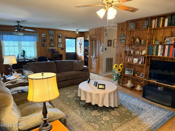 a room with furniture and musical instruments