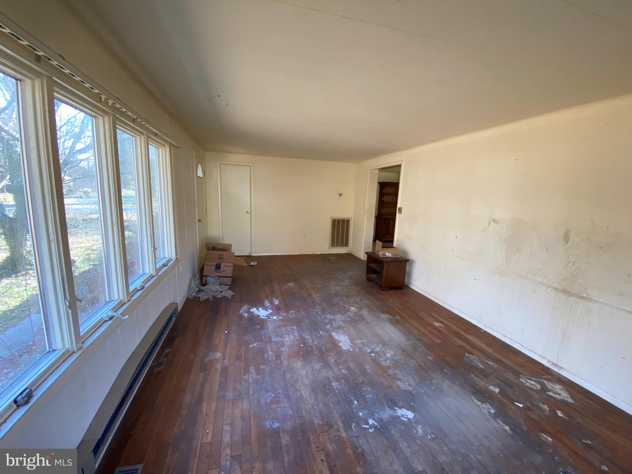 217 Edmore Road Chestertown, MD 21620 - Photo 13 of 30 Wood floors/front entrance in living room.
