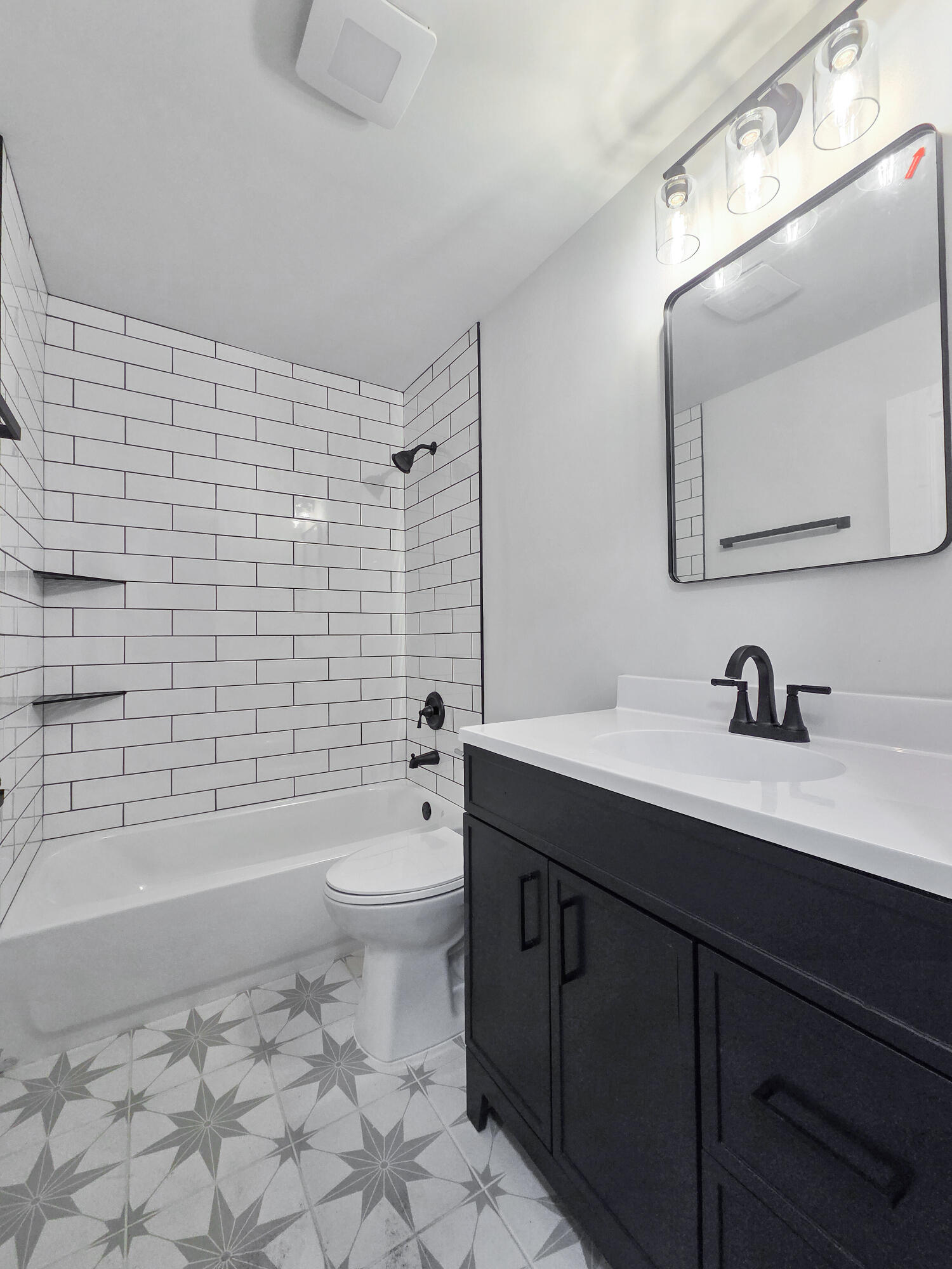 1629 Tennessee Street Gary, IN 46407 - Photo 11 of 26 a bathroom with a sink a toilet and shower