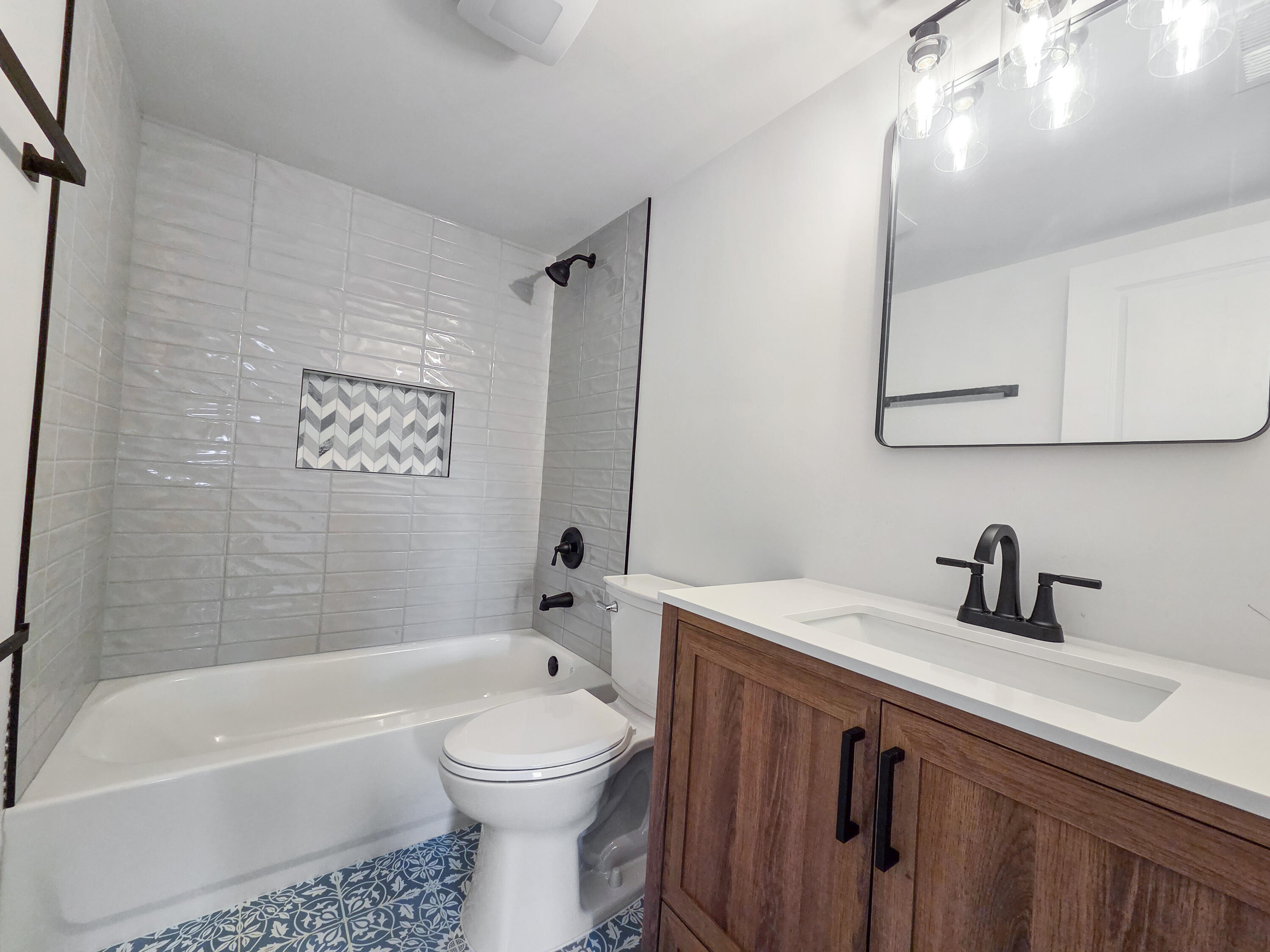 1629 Tennessee Street Gary, IN 46407 - Photo 18 of 26 a bathroom with a sink a toilet and bathtub
