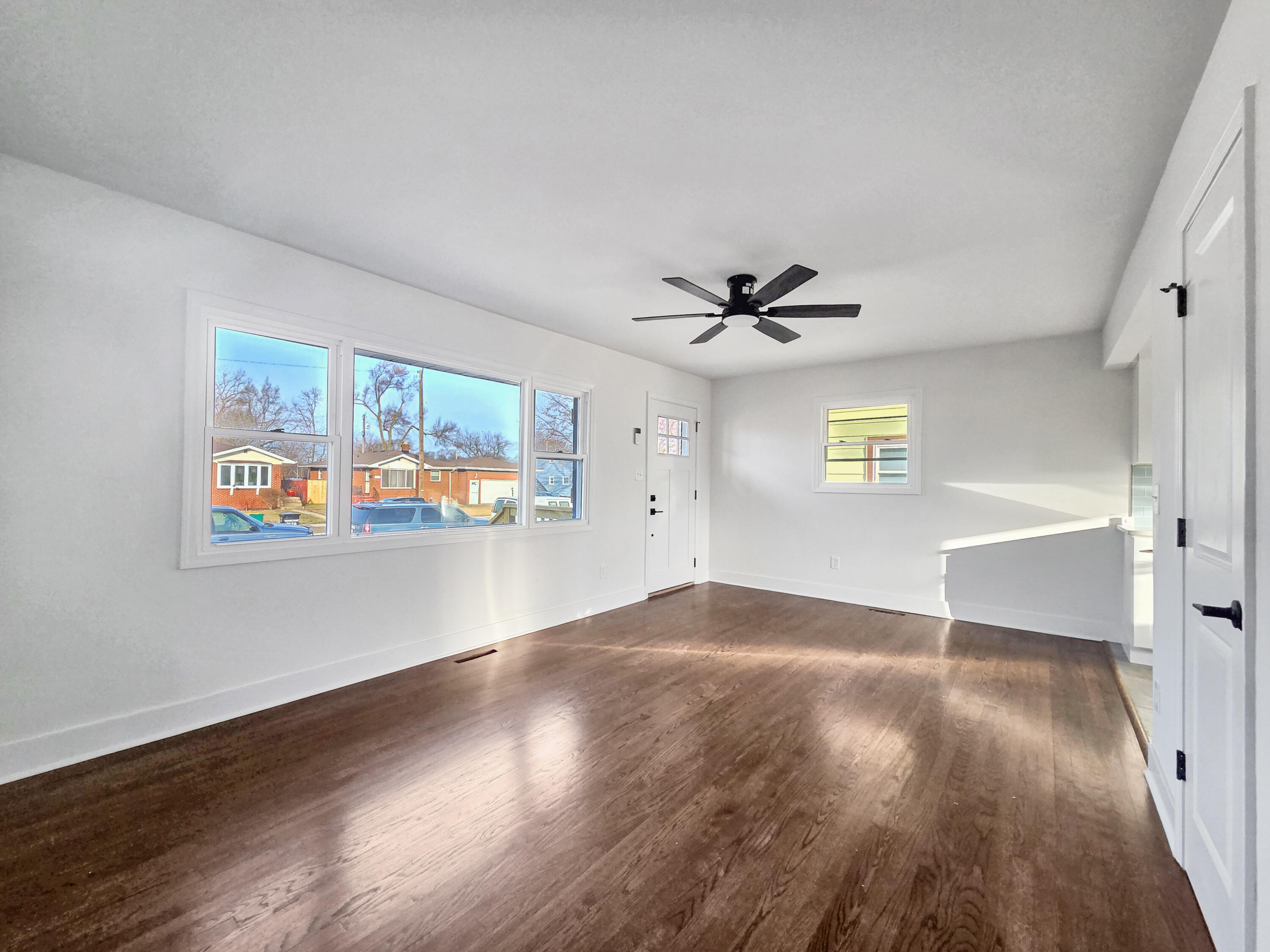 1629 Tennessee Street Gary, IN 46407 - Photo 4 of 26 a view of an empty room with window and wooden floor