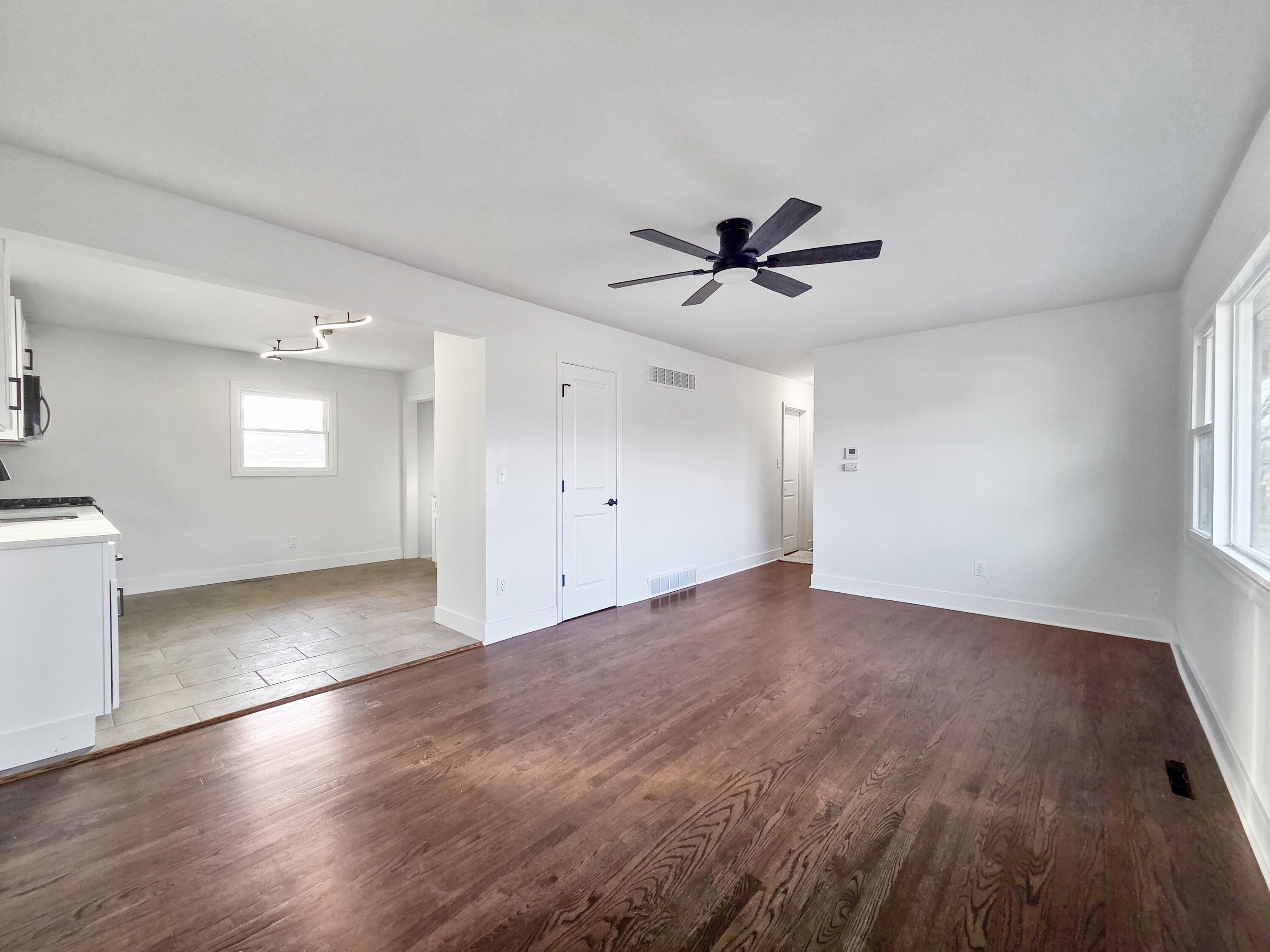 1629 Tennessee Street Gary, IN 46407 - Photo 6 of 26 wooden floor in an empty room with a window