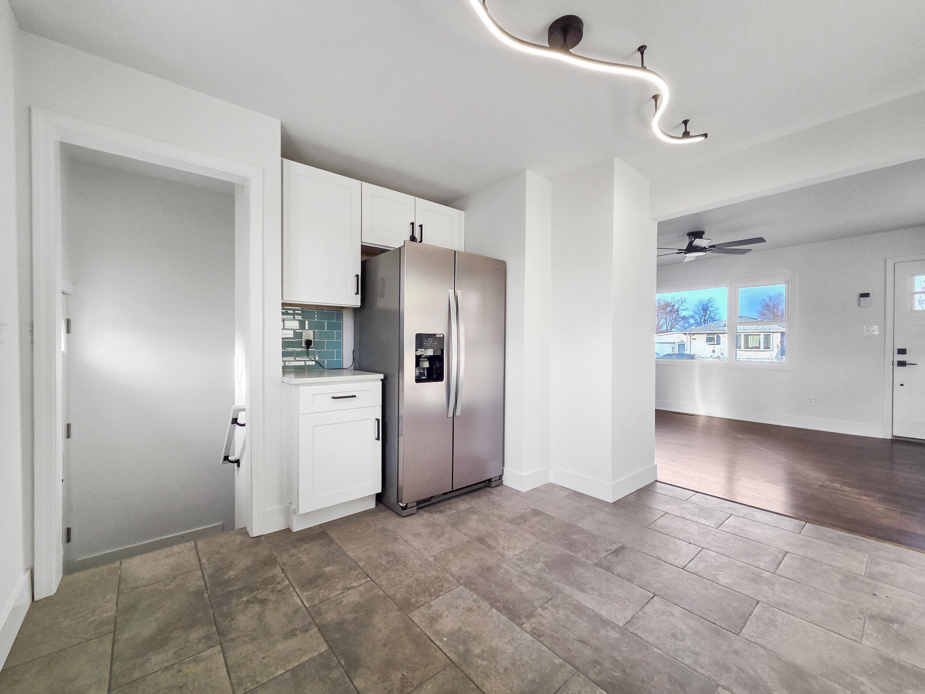 1629 Tennessee Street Gary, IN 46407 - Photo 10 of 26 a view of a refrigerator in kitchen and an empty room