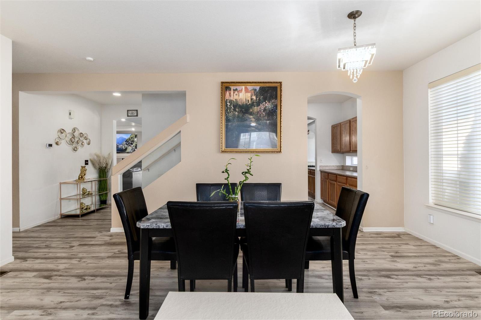 5293 Malaya Street Denver, CO 80249 - Photo 11 of 44 a view of a dining room with furniture and window