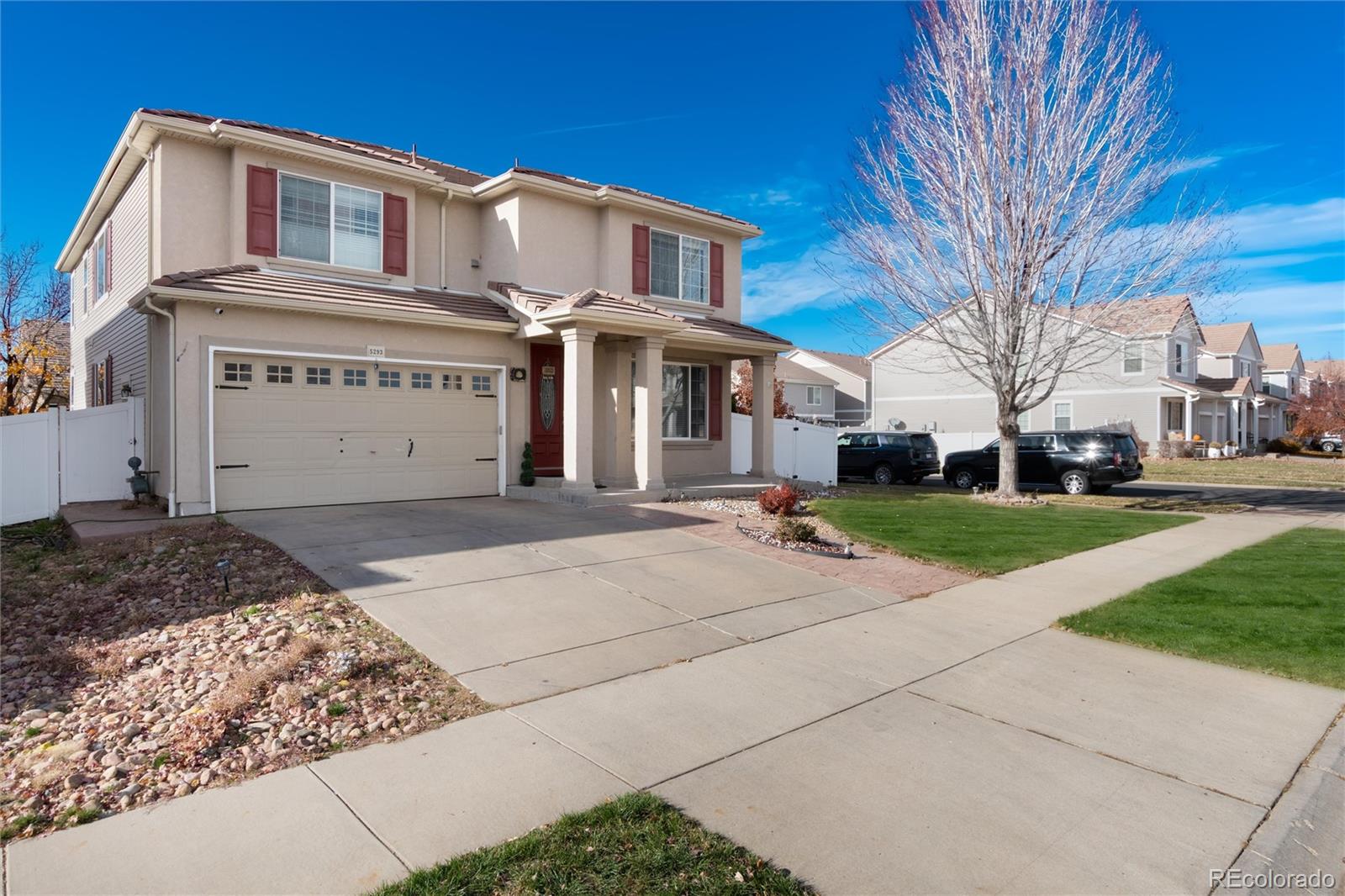 5293 Malaya Street Denver, CO 80249 - Photo 2 of 44 a front view of a house with a yard