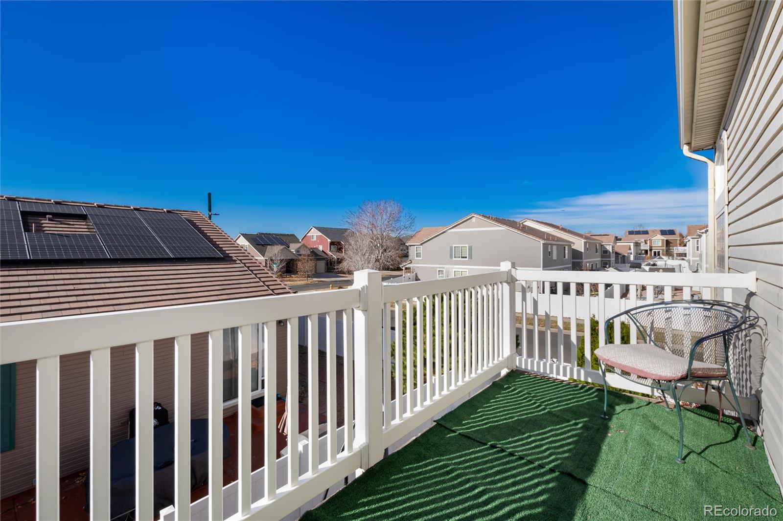 5293 Malaya Street Denver, CO 80249 - Photo 34 of 44 a view of a balcony with two chairs