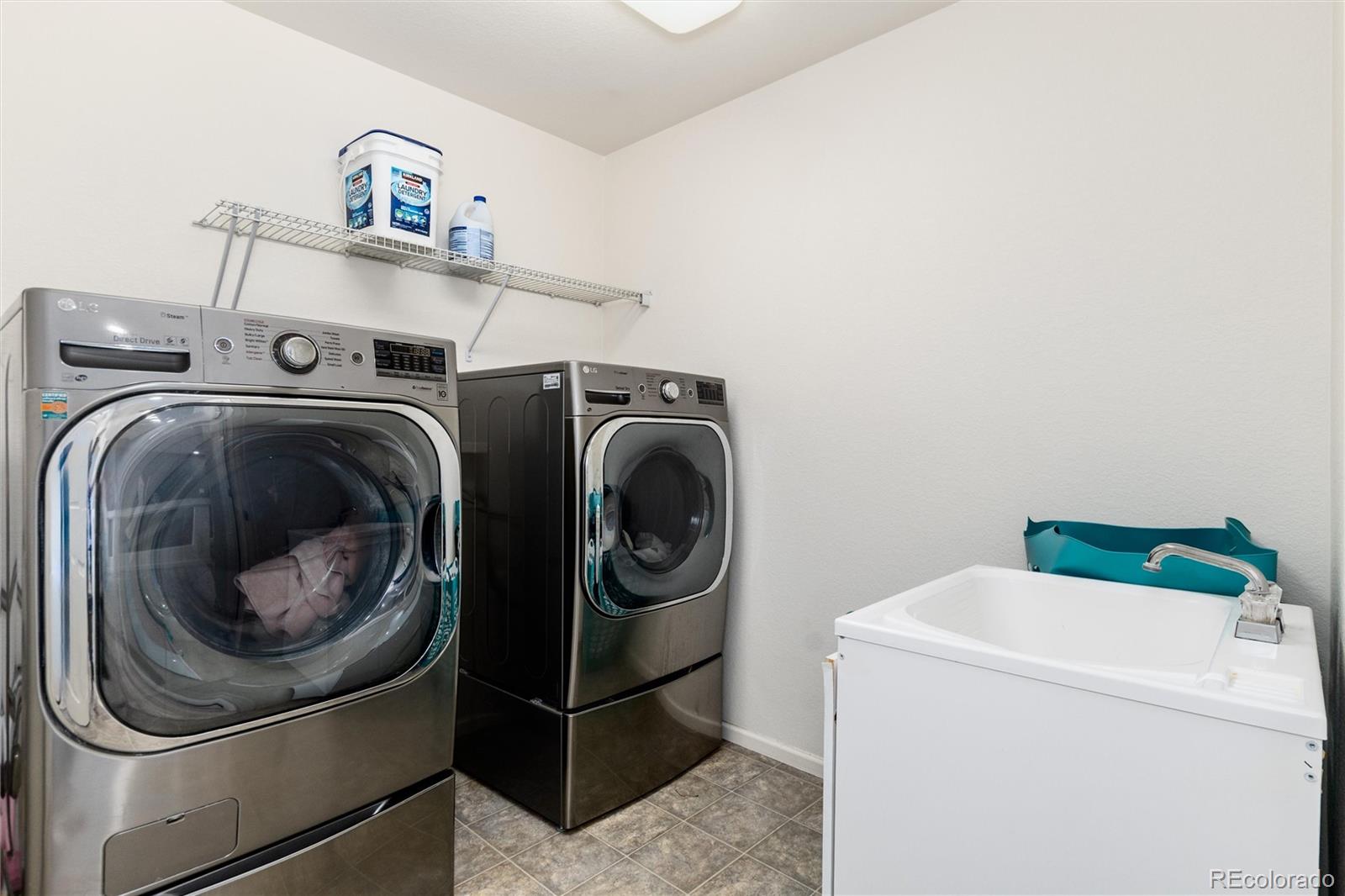 5293 Malaya Street Denver, CO 80249 - Photo 35 of 44 a utility room with dryer and washer