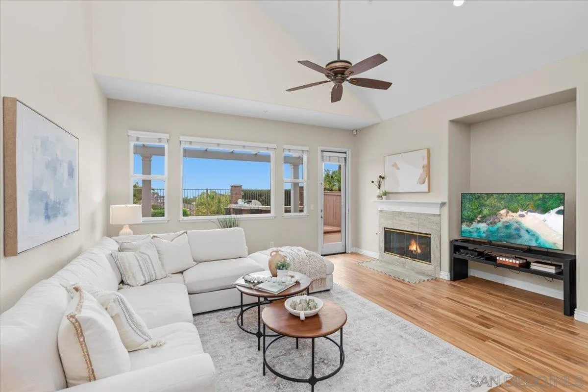 622 Brae Mar Court Encinitas, CA 92024 - Photo 12 of 24 a living room with furniture fireplace and a flat screen tv