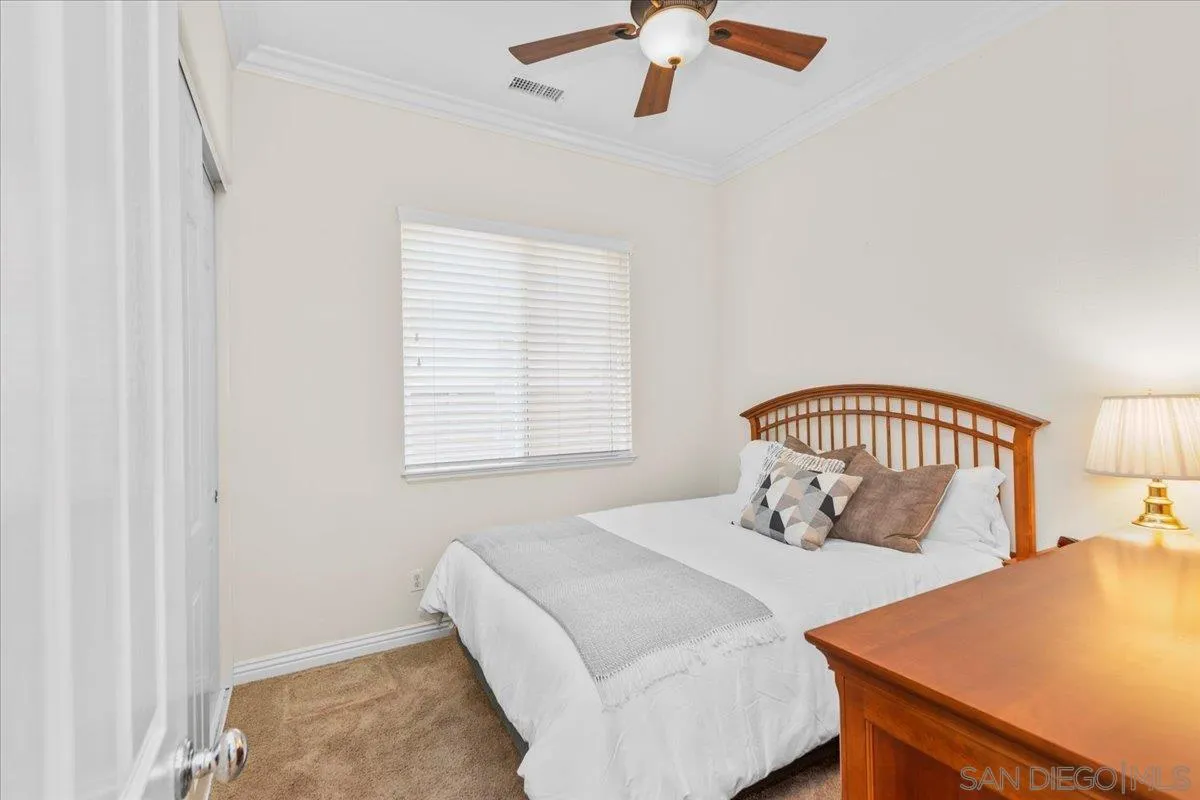 622 Brae Mar Court Encinitas, CA 92024 - Photo 13 of 24 a bedroom with a bed and a table