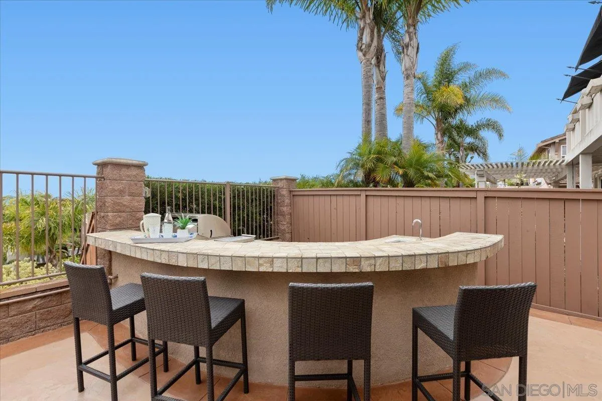 622 Brae Mar Court Encinitas, CA 92024 - Photo 20 of 24 a view of a chairs and table in the backyard
