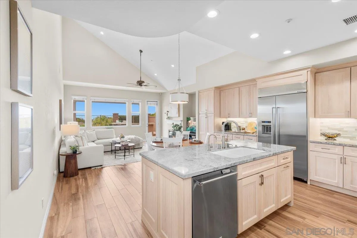 622 Brae Mar Court Encinitas, CA 92024 - Photo 10 of 24 a open kitchen with stainless steel appliances granite countertop a lot of counter space and wooden floors