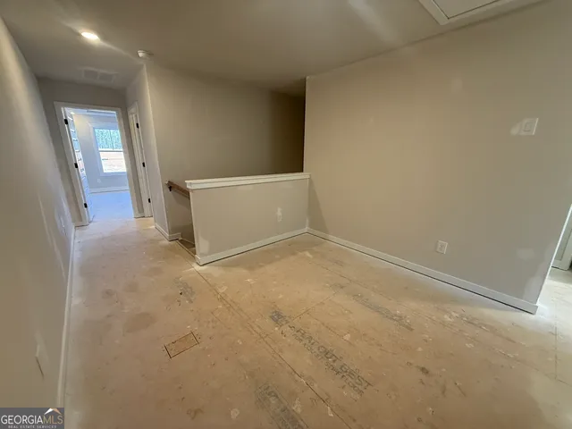 a view of a hallway with closet area