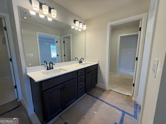 a bathroom with a glass shower door
