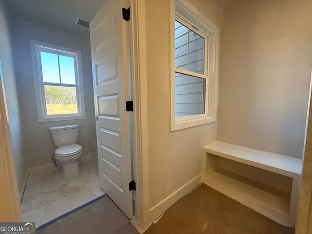 a view of a room with racks on the wall