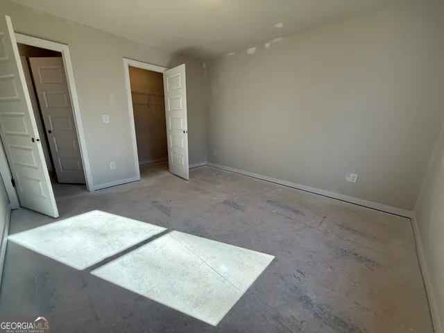 a view of a yard with cars parked on the road