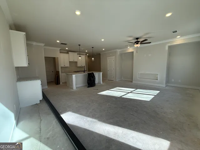 a large room with a large window and chandelier
