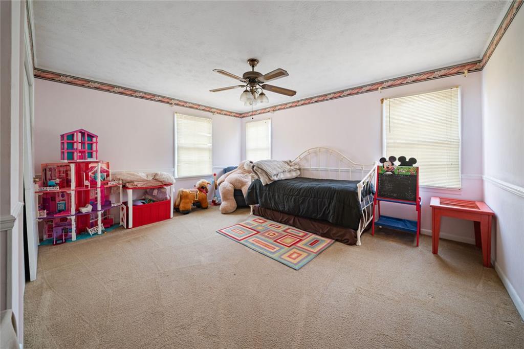 2980 Highway 46 Soperton, GA 30457 - Photo 20 of 27 a bed room with furniture and window