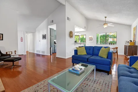 a living room with furniture rug and window