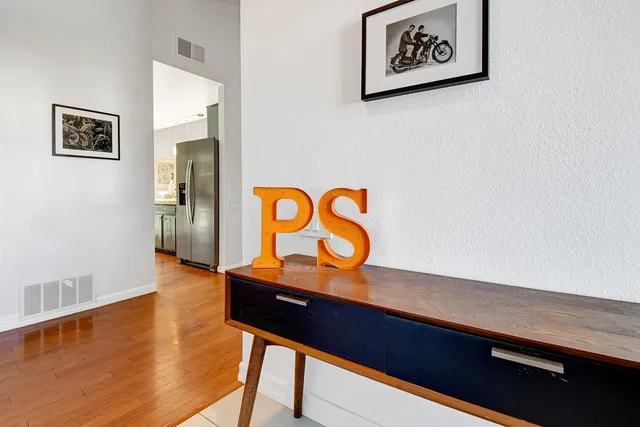 a view of room with window and wooden floor