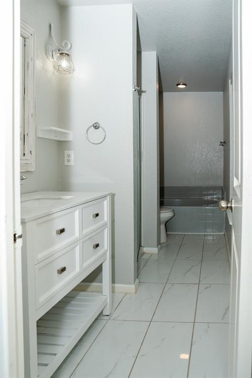 2129 Bliss Road Fort Worth, TX 76177 - Photo 14 of 22 a bathroom with a mirror and a shower