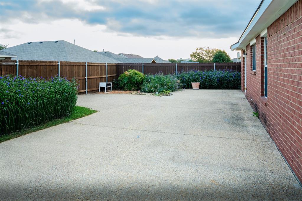 2129 Bliss Road Fort Worth, TX 76177 - Photo 19 of 22 a view of a house with a yard and potted plants
