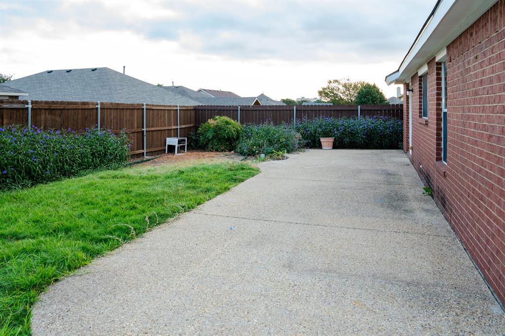 2129 Bliss Road Fort Worth, TX 76177 - Photo 20 of 22 a view of a house with a yard and potted plants