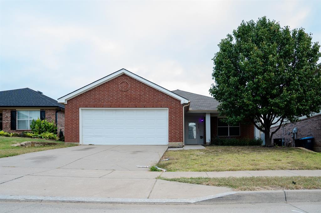 2129 Bliss Road Fort Worth, TX 76177 - Photo 3 of 22 a front view of a house with a yard and garage