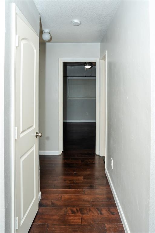 2129 Bliss Road Fort Worth, TX 76177 - Photo 8 of 22 a view of a hallway with wooden floor and staircase